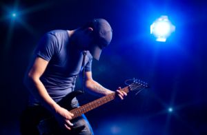 guitarist onstage, wedding officiant