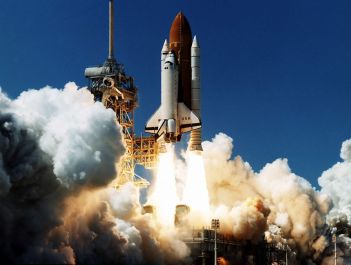 Space shuttle launching into space