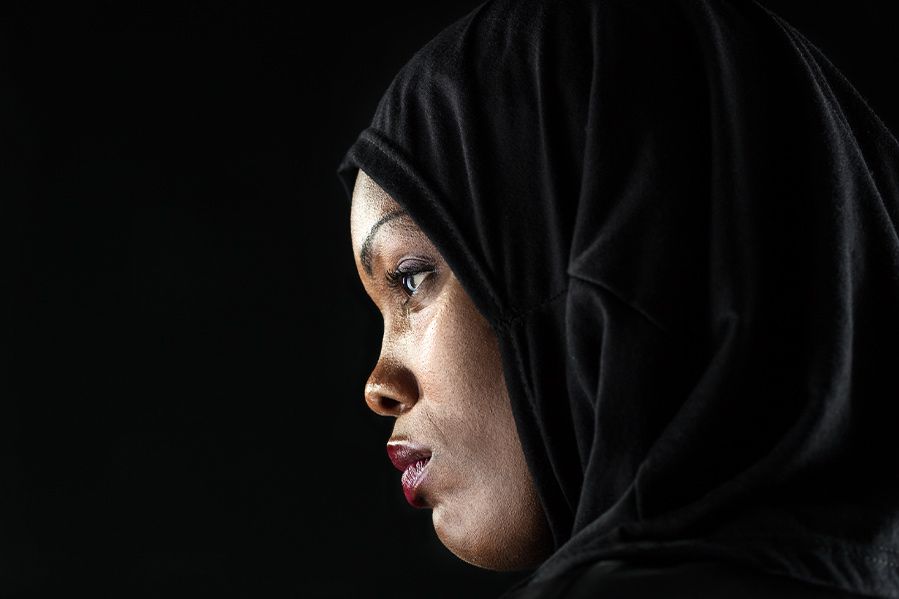 sad looking woman in black hijab