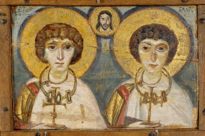 An ancient portrait of Sergius and Bacchus, two young men standing next to one another with light behind their heads. A small image of Jesus appears inset above them.