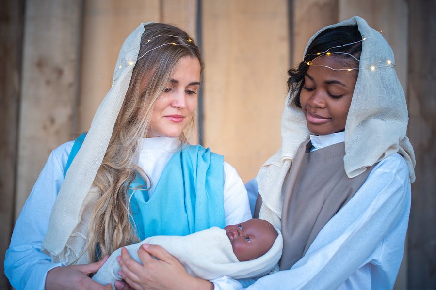 nativity scene with two mothers holding baby jesus