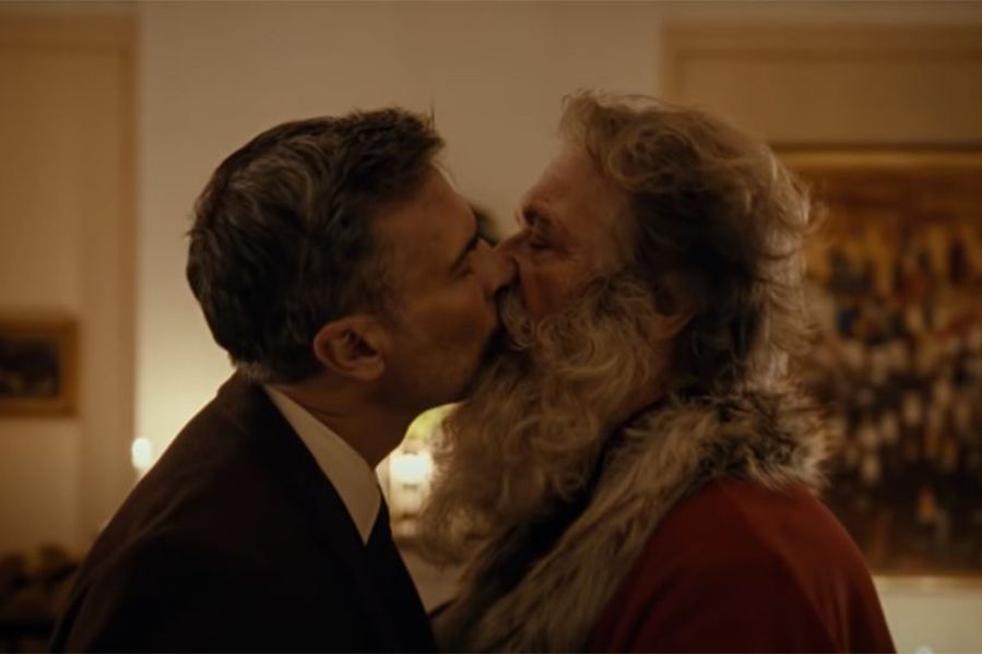 santa kissing man