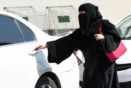 Saudi woman entering car
