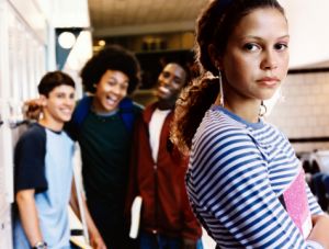 group of high school boys bullying student