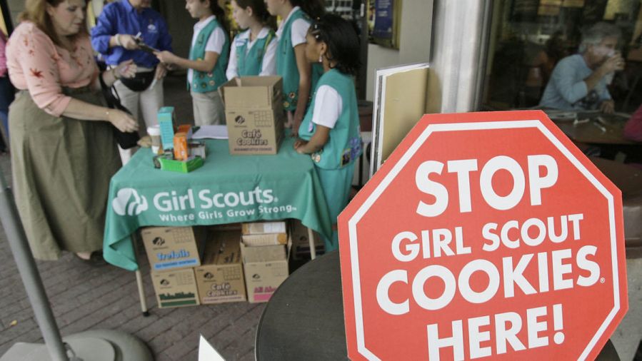 Girl Scouts selling cookies