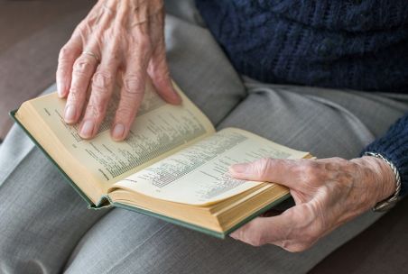 Older person reading a Bible