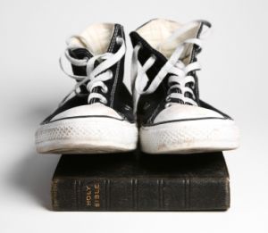 converse shoes atop holy bible