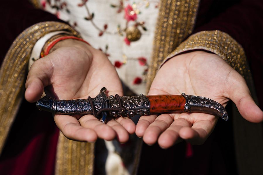 Sikh man holding kirpan