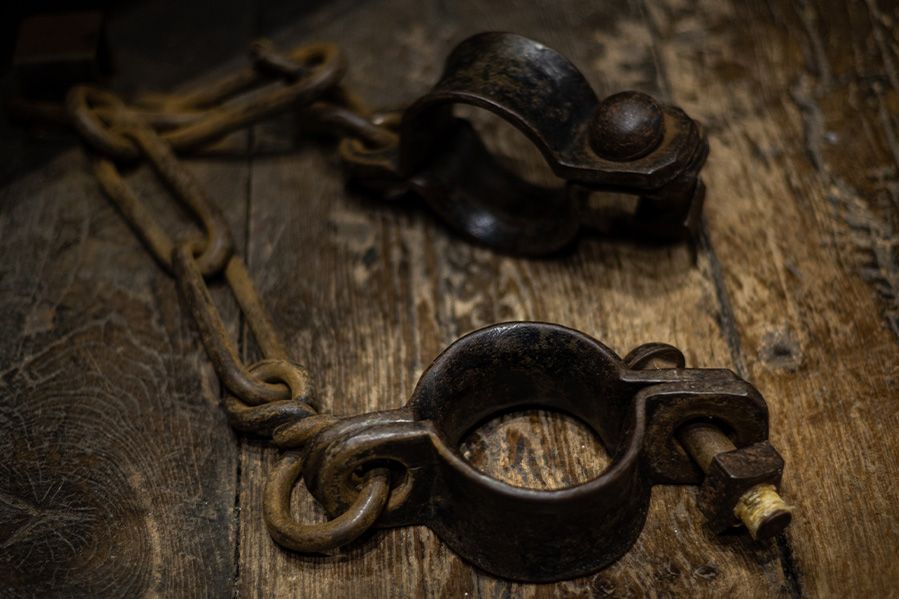 iron shackles on wooden floor