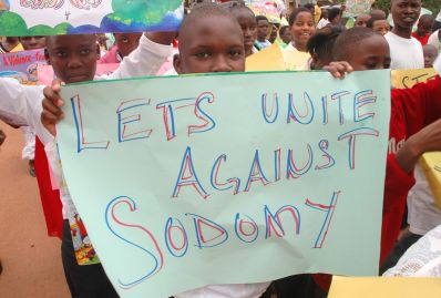 African children holding anti-gay signs.