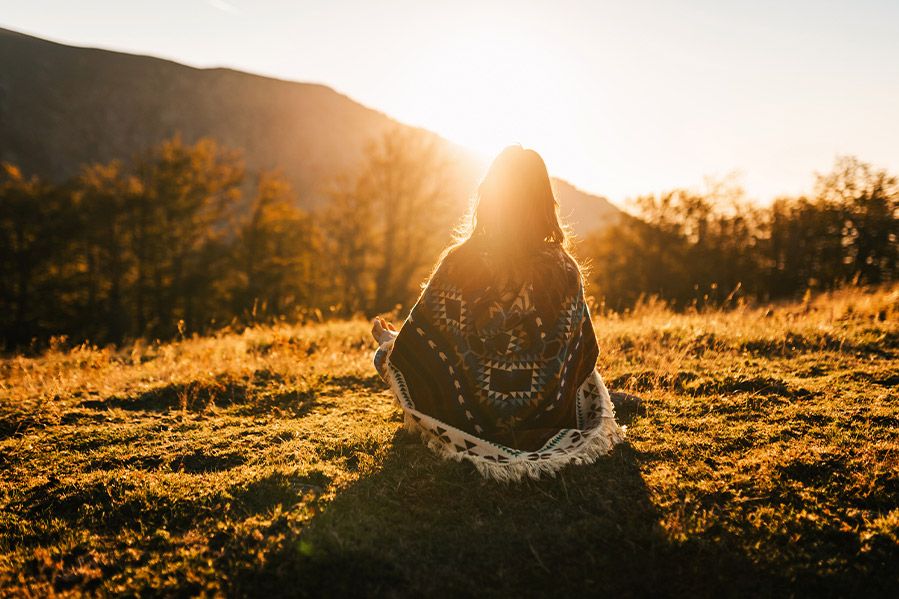 non-religious woman meditating in nature