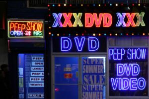 exotic neon lights in front of a pornography store