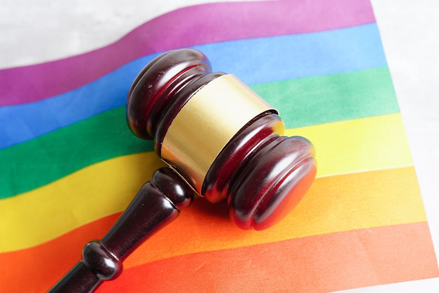 legal gavel resting on LGBTQ pride flag