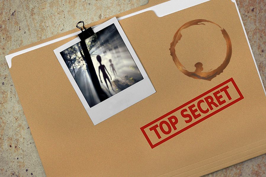 top secret folder with photograph of aliens