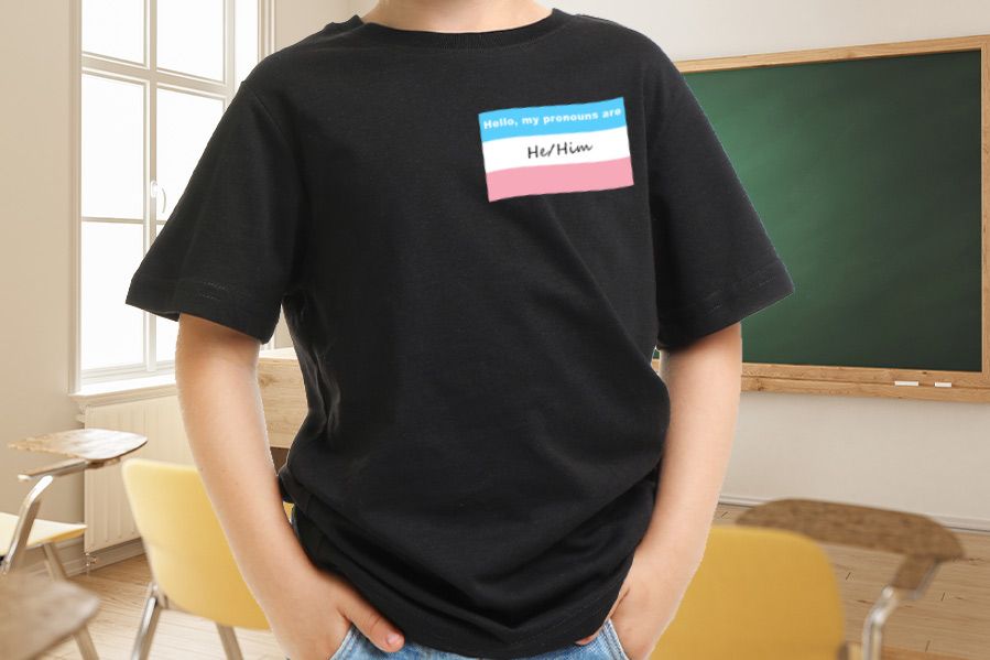 Child with pronoun sticker