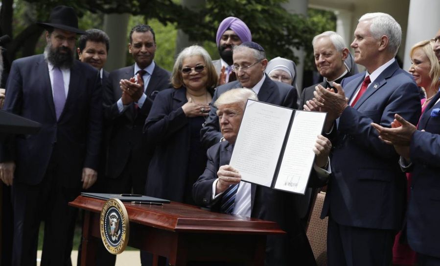 President Trump signing an executive order on religious freedom
