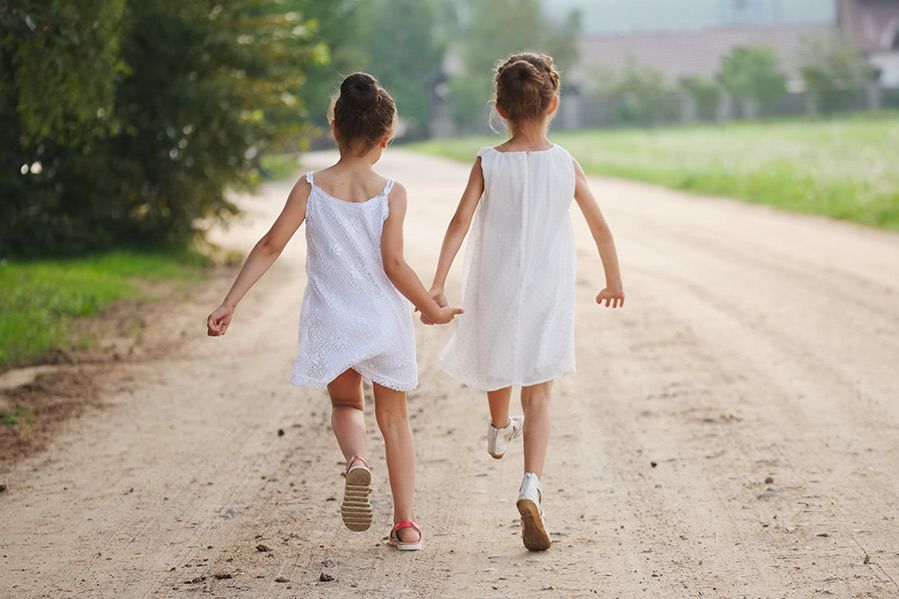 two little girls holding hands