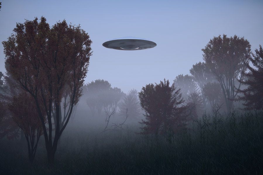UFO hovering over foggy field