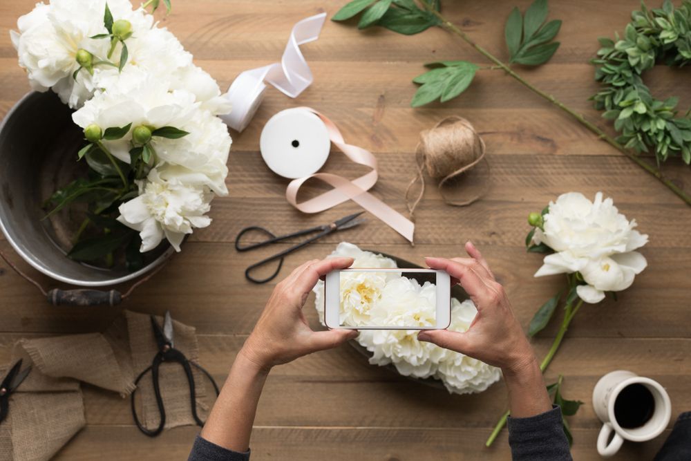 Person taking a photo of wedding decorations