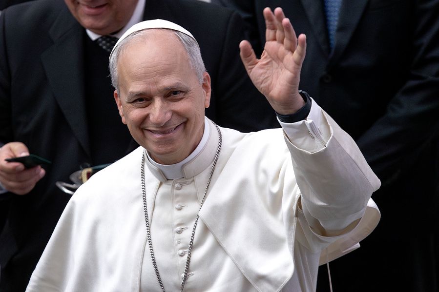 pope leo smiling and waving to crowd