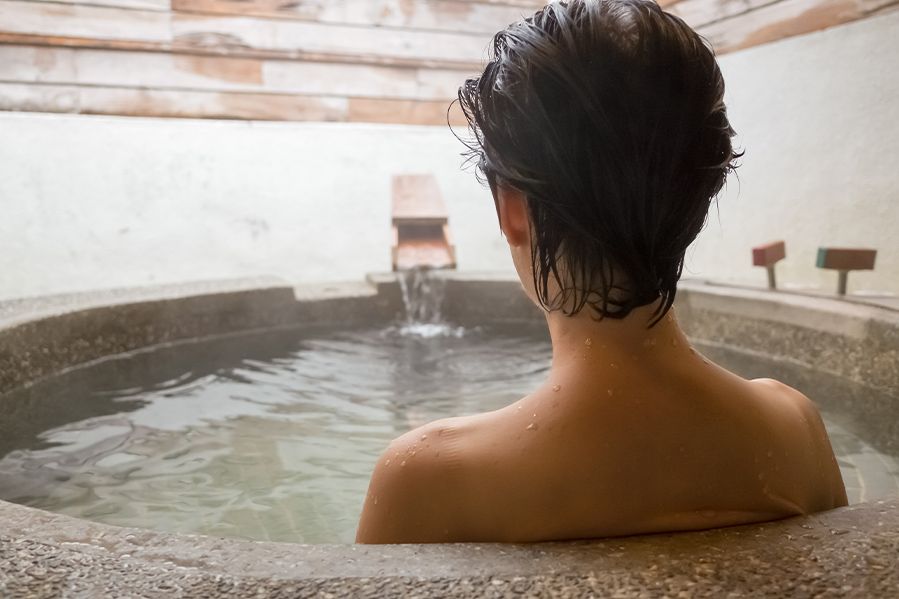 woman bathing in spa bath