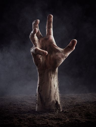 zombie hand reaching out of ground