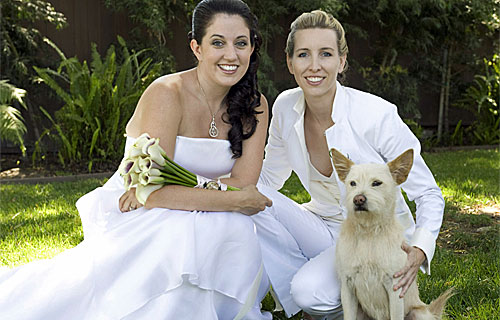 lesbian brides with dog on wedding day