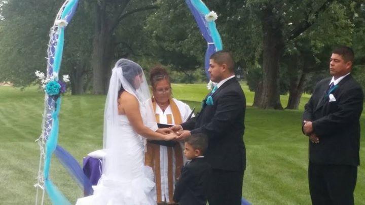 Affordable Bilingual wedding officiant ( English & Spanish). I have been an ordained minister since June of 2013 and have enjoyed participating and helping couples prepare their wedding ceremony. I am a Christian but I prepare wedding ceremonies for all religious and non-religious individuals. I also do alterations and make personalized veils by incorporating colors or incorporating old memories into your veil. The bride in this picture is wearing her deceased mothers wedding dress. I will go any where in Michigan as long as travel expenses are met.