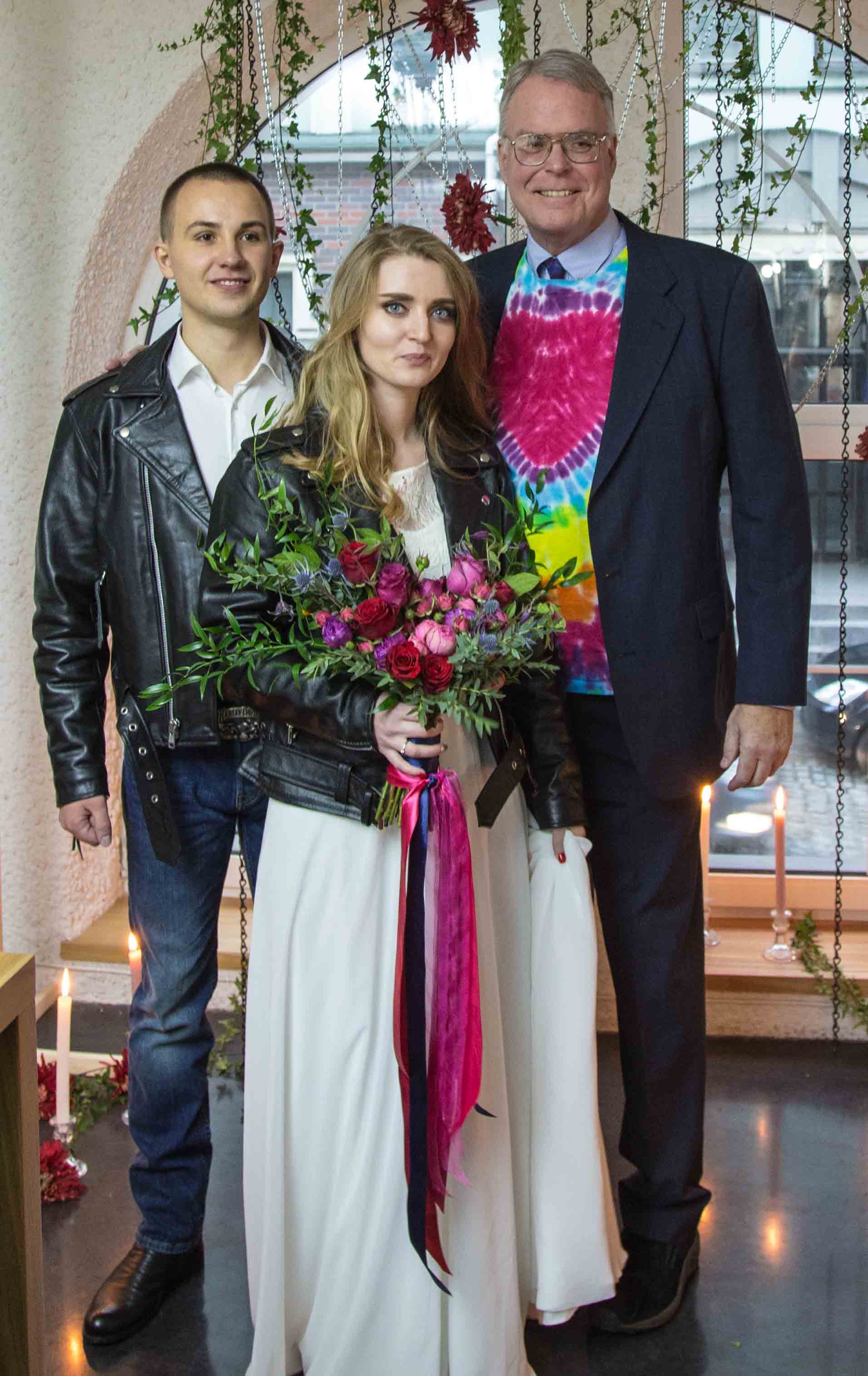 Yaroslav and Maryna wanted a "rocker" wedding, which meant their jackets and my shirt. I wrote the ceremony, translated it into Russian (which I am studying), and spoke the ceremony in Russian. Everyone should have heart shirts! My translator, Khristina, is on the left. Then Antonina, her son Yaroslav, Maryna, her mother Svetlana, and their friend Natali. This was at the "Parents' Dinner," the night before. Yaroslav's father is no longer alive, and Maryna's father is gone and estranged. Sad.