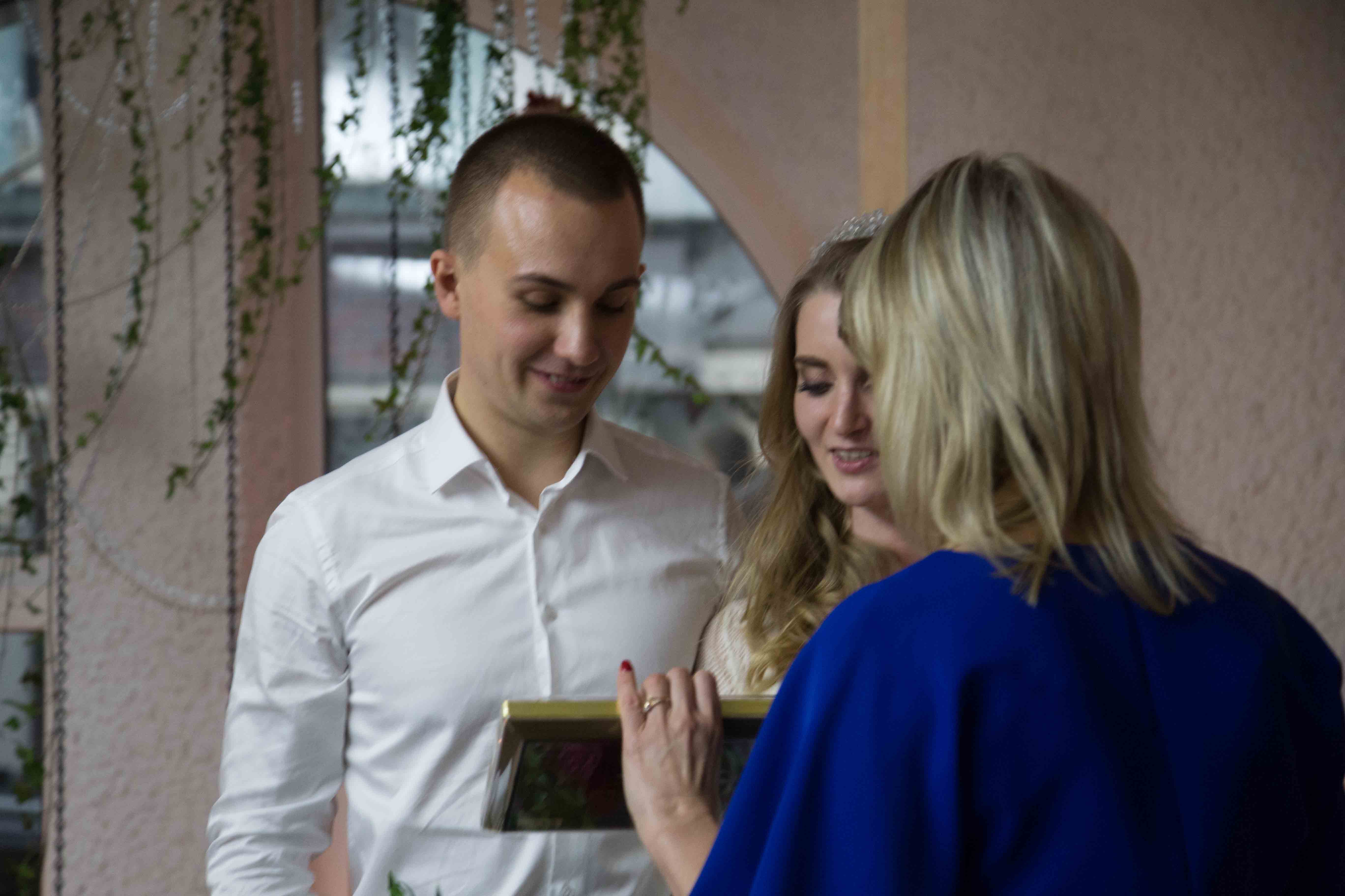 Svetlana presented the bride and groom with pictures of Mary and Jesus, and said a blessing. This is a very Ukrainian tradition. when the couple arrived, the two Moms and I presented them with bread and salt, which they ate. This is the Ukrainian tradition equivalent to throwing rice. I was thrilled that the two Moms added these Ukrainian elements to my otherwise very Western ceremony. Typically, the orthodox priest does it to them. No dedication, no vows, no promises with exchanging rings. They got all that from me. They're probably the only couple in Ukraine to have had a Western ceremony in Ukraine, performed by an American minister, in Russian. It ranks as one of the most wonderful experiences of my life, and brings tears even now when I remember it.