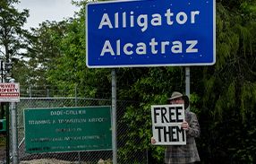 religious protester outside alligator alcatraz