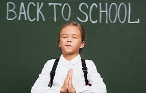 girl praying at school