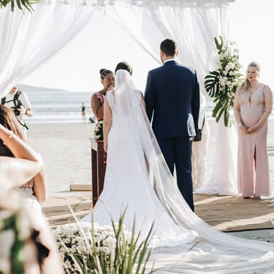 Minister Performing Beach Wedding