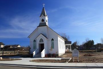 A small white church with steeple