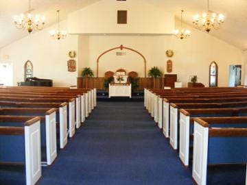 Rows of pews in a small church