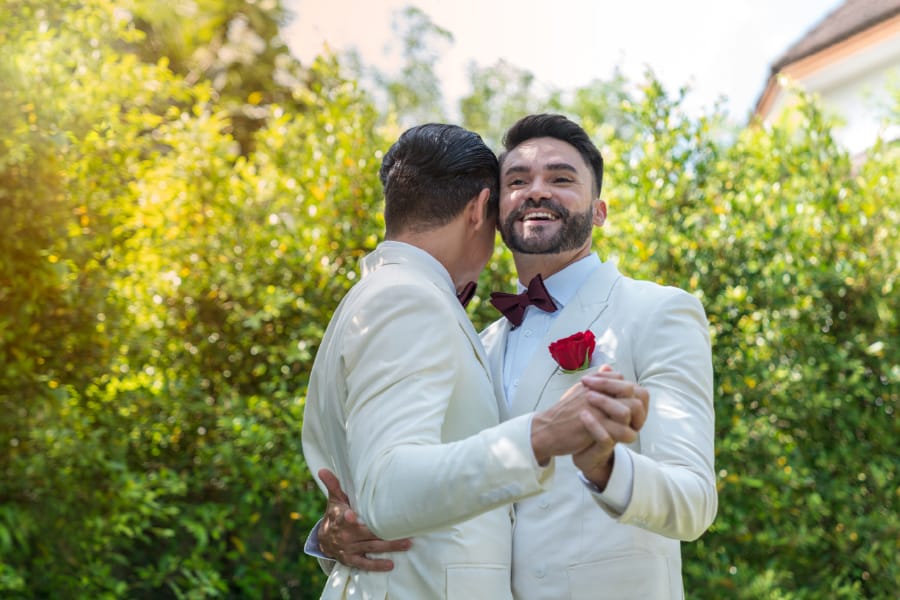 Grooms sharing first dance after garden themed wedding