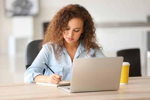 Woman creating a wedding script