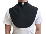 Black clerical dickey from the Universal Life Church. Worn underneath clothes, this garment is used to create a professional clergy image while on a budget.