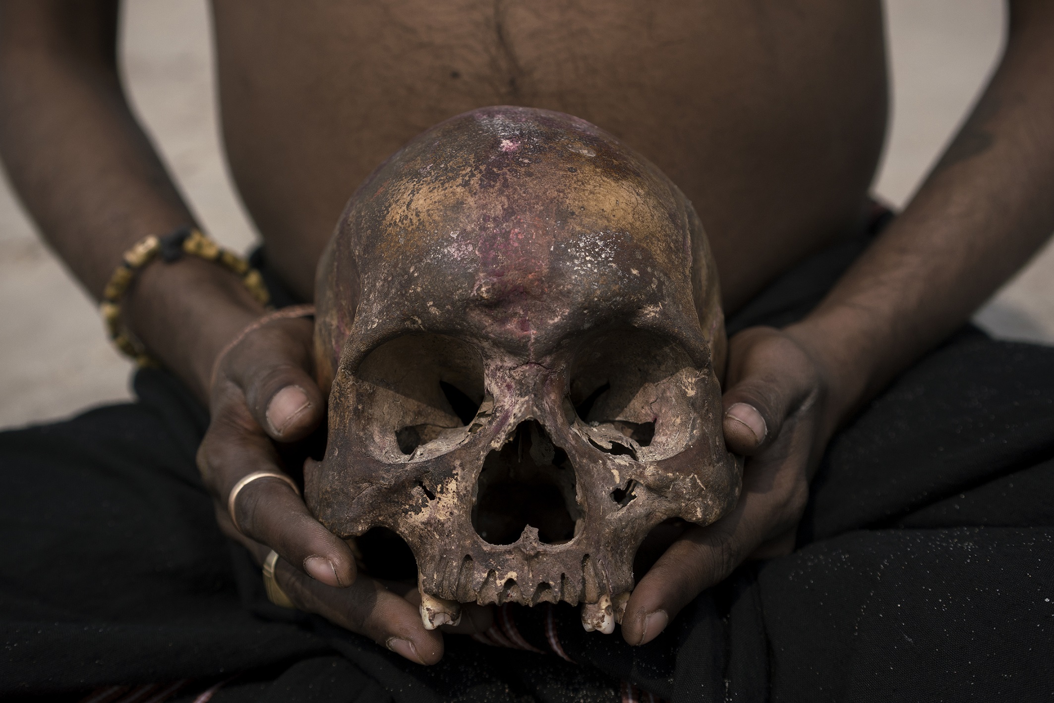 Aghor person carrying a skull