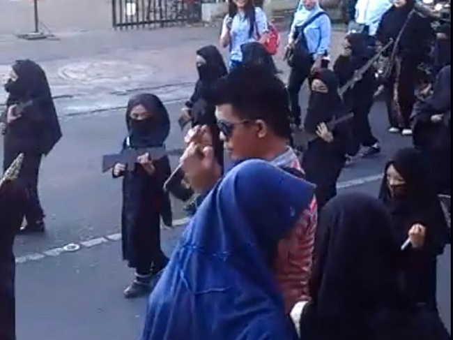 Youth dressed as ISIS soldiers in parade