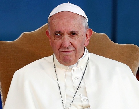 Pope Francis sitting in a chair