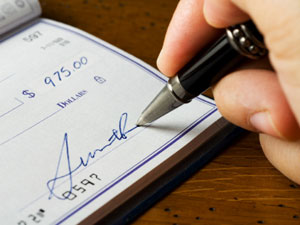 Ministerial Discounts Signing a Check